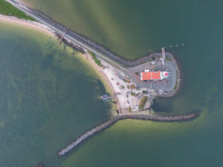 Top down aerial view of lighthouse on peninsula in the Netherlandsの写真素材