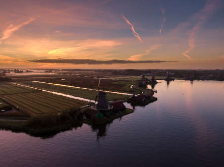 Aerial of classic Dutch windmills at the Zaanse Schans during a stunning sunriseの写真素材