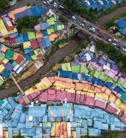 Top down aerial view of colorful rainbow village Jodipan in the city of Malang, on East Java, Indonesiaの写真素材