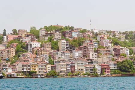Istanbul Turkey May 30 2013. A variety of lowrise houses on a hill near the sea.のeditorial素材