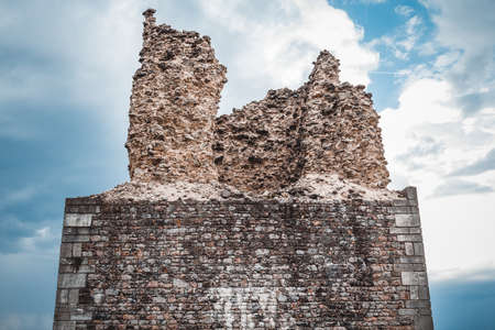 Severely damaged fortifications on the mountain top.の写真素材