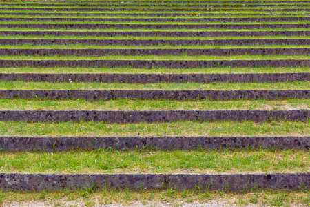 Plurality of layers overgrown with grass in old summer theater.の写真素材