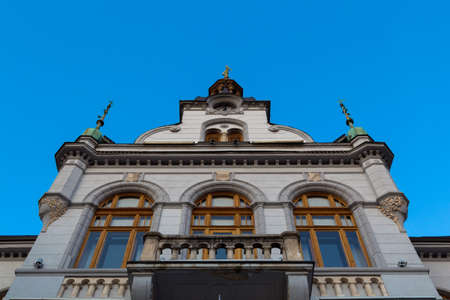 Old mansion on a background of blue sky, view from the bottom.の写真素材