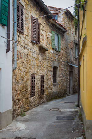Small medieval deserted seaside European street.の写真素材