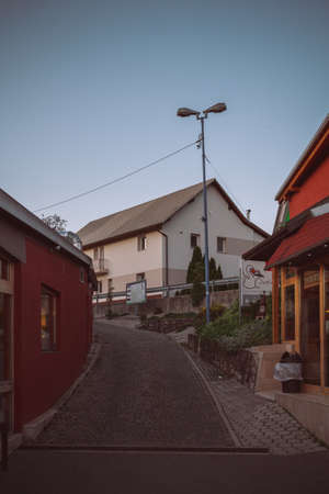 Street in a deserted village slightly goes to the left.の写真素材