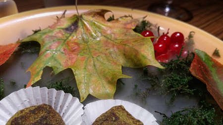 maple leaf, potassium, needles and candy in a plate, haute cuisineの写真素材