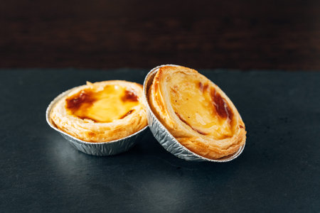 Golden Portuguese Custard Tarts on Slate Background, Traditional Pasteis de Nata