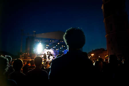 people watching open air concertの写真素材