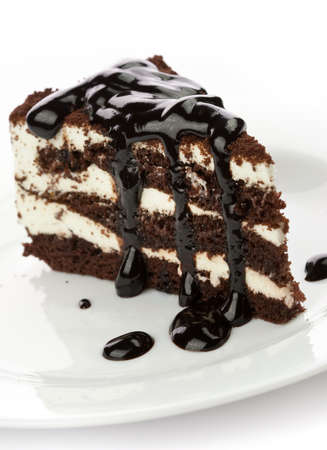 Piece of cake with black chocolate syrupの写真素材