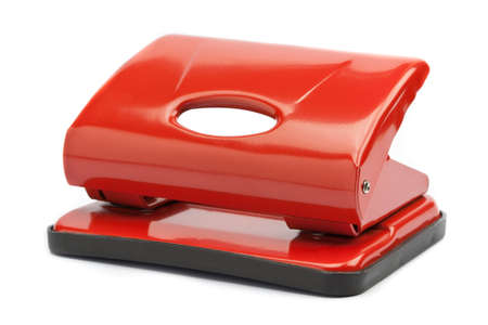 Red office paper hole puncher, isolated on whiteの写真素材