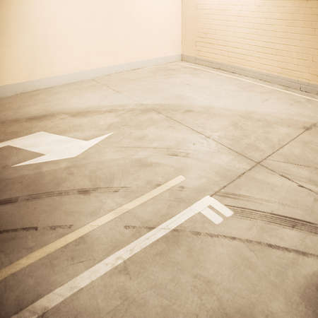 Empty parking lot floor and wall. Composition can be used as background.