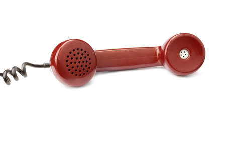 Red old telephone receiver isolated on white background