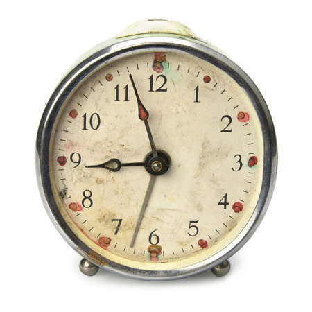 Old broken vintage alarm clock, isolated on white