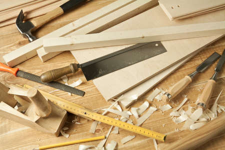 Wooden workshop table with tools.