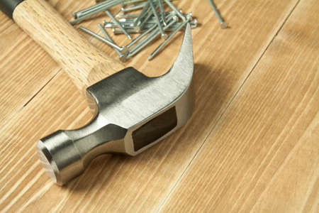 Wooden planks, hammer and nails.の写真素材