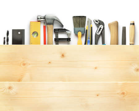 Carpentry background. Tools underneath the wood plank.の写真素材