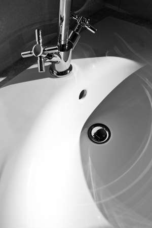Faucet and sink in a modern bathroomの写真素材