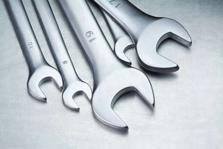 Spanners, wrenches on a metal table