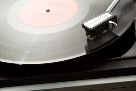 Vintage record player with spinning vinyl の写真素材