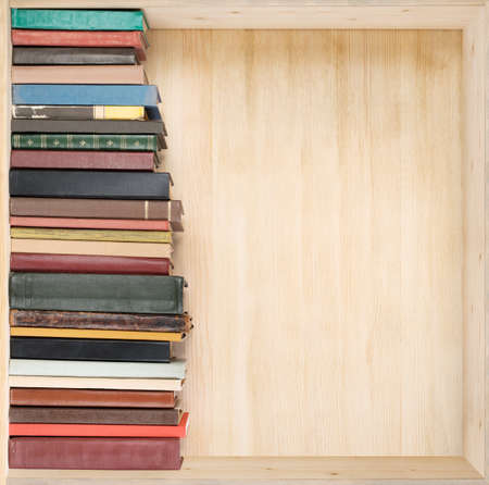 Old books on a wooden shelf.の写真素材