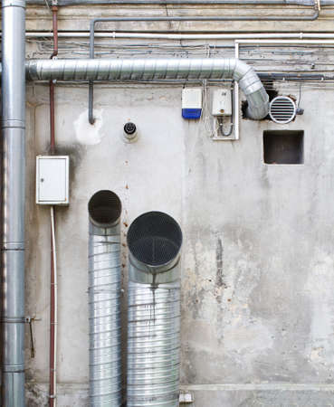 Pipes and wires on the wall の写真素材