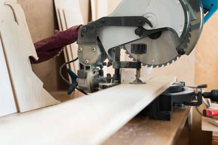 Circular saw and wood plank 