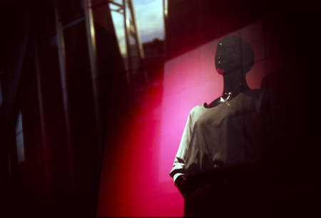 Mannequin in showcase with reflections. Fashion background.の写真素材