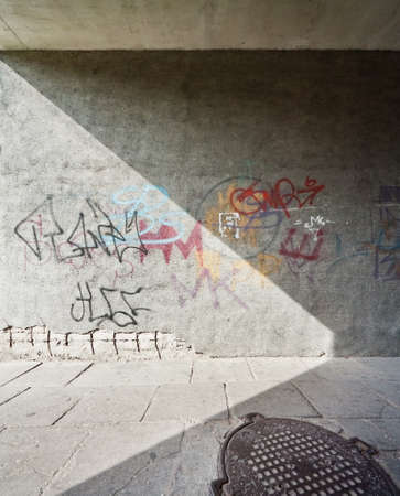 Urban background. Abstract geometrical shapes and some graffiti on the street wall.の写真素材