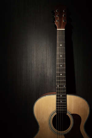 Acoustic guitar in the darkの写真素材