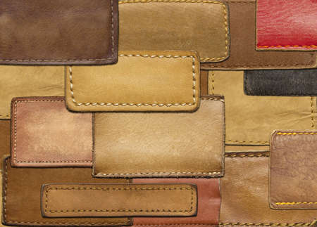 Leather background made of jeans labelsの写真素材