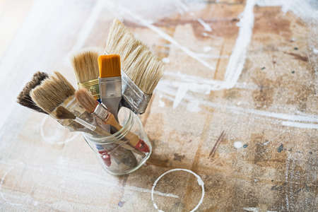 Paint brushes on the workshop table.の写真素材