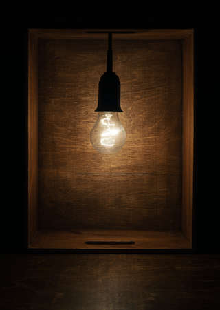 Light bulb in wooden boxの写真素材