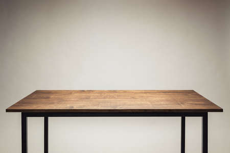Wooden table against gray background.の写真素材