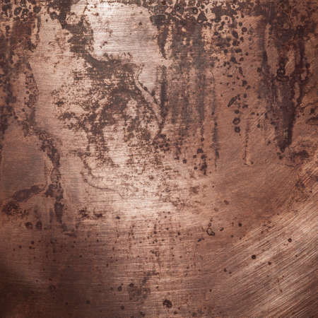 Aged copper plate texture, old worn metal background.の写真素材