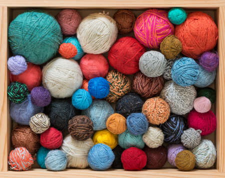 Colorful yarn balls in wooden boxの写真素材