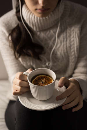 Girl with cup of tea, hands details