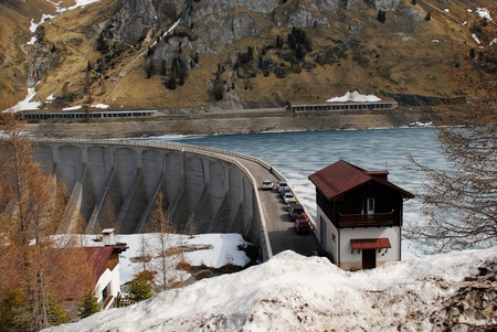 Frozen Lake Fadaia  Lago di Fadaia  thawing in the sprint at the western Italian Dolomitesの写真素材