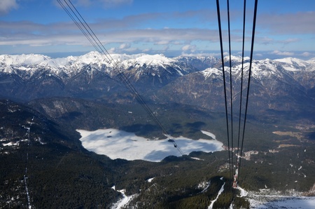 Frozen Lake and Snow-Capped Mountains in the Alps