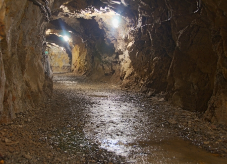 A lighted underground tunnel in a nickel mine