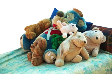  Old stuffed animals lying on a bed in a day care back yard  Isolated on white の写真素材