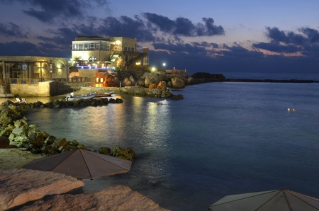Caesarea Harbor and the Mediterranean after Sunset (blue hour)の写真素材
