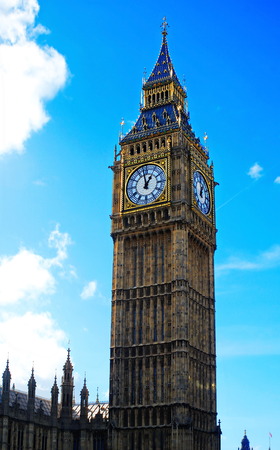 The London Big Ben with a blue sky and cloudsの写真素材
