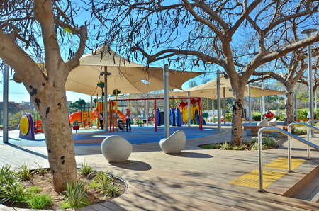 KFAR SABA, ISRAEL - MARCH 28, 2014  Unidentified people in a contemporary outdoor playground in Kfar...