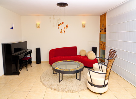 A warm and modern designer living room done with contemporary materials and colorsの写真素材