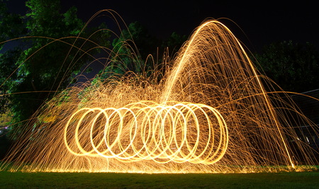 Steel wool light painting - brilliant fireworks from steel woolの写真素材