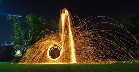 Steel wool light painting - brilliant fireworks from steel woolの写真素材