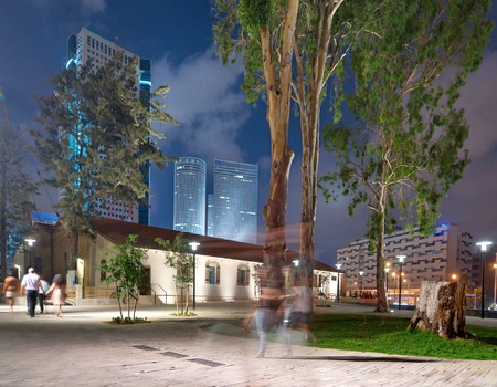 Old and New Architecture in Tel Aviv - Old and modern buildings at night at the hip Sarona district featuring rich night life and conserved Templer era German architecture from the late 1800'sのeditorial素材