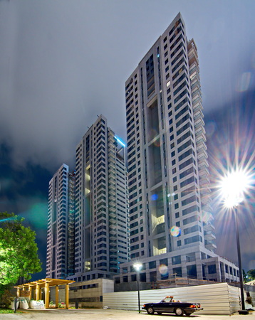 TEL AVIV - AUG 15, 2014: New Construction in Tel Aviv - newly contructed modern towes in the hip downtown Sarona neighborgood inTel Aviv at night with lens flareのeditorial素材