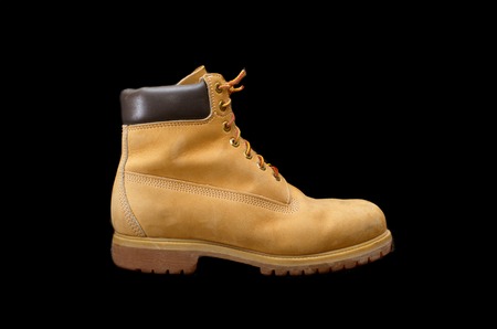Authentic 8 inch Yellow Work Boot isolated on blackの写真素材
