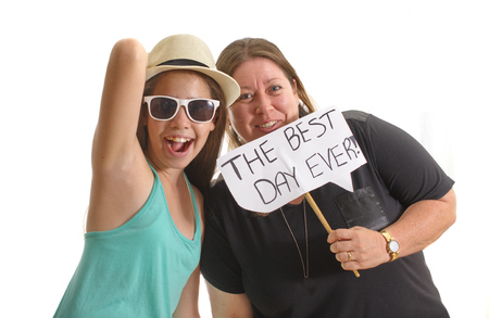 Mother and daughter having the Best Day Ever - holding a signの写真素材